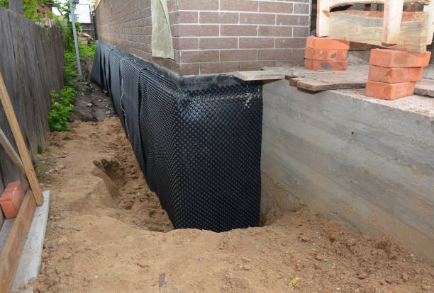SJ Waterproofing Pros technician performing targeted Wet Basement Repair assessment in Harbor View, OH